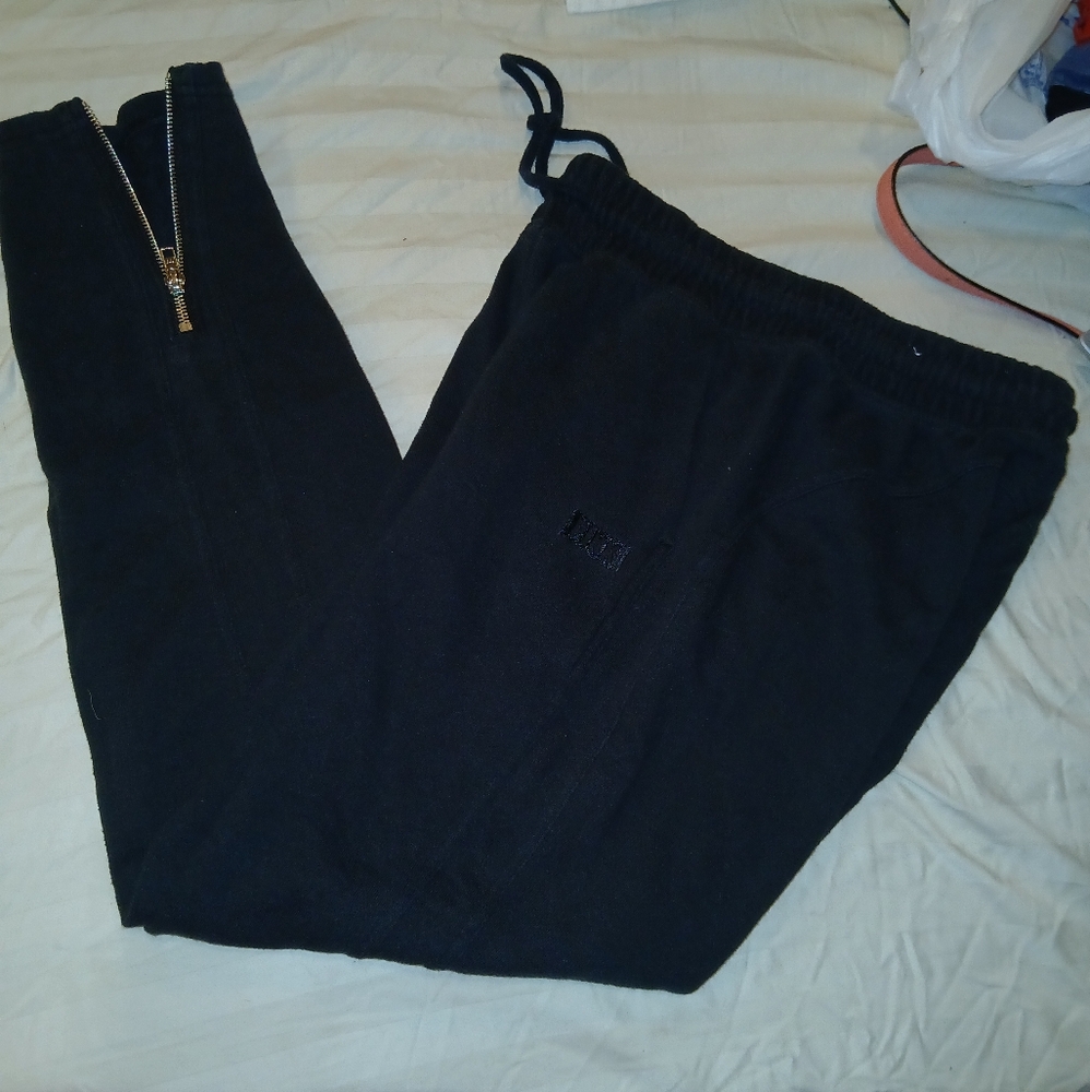 Victoria secret black sweat pants with zippers at the bottom of the legs